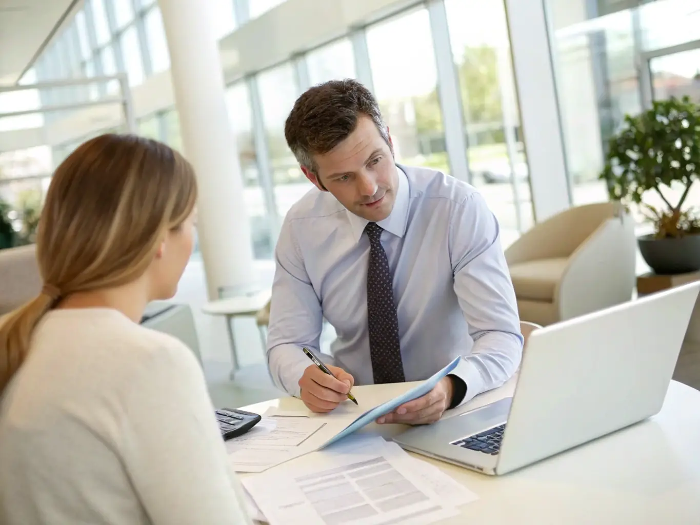 An experienced Irongate Lending mortgage expert providing clear and concise advice to a client via video call. The expert is using visual aids to explain complex mortgage concepts.